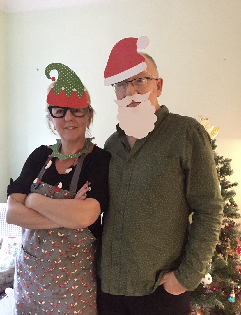 Parents wearing santa hats