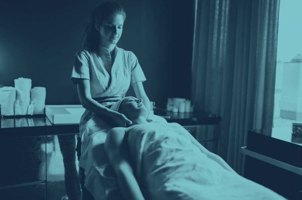 Woman giving a massage on a table