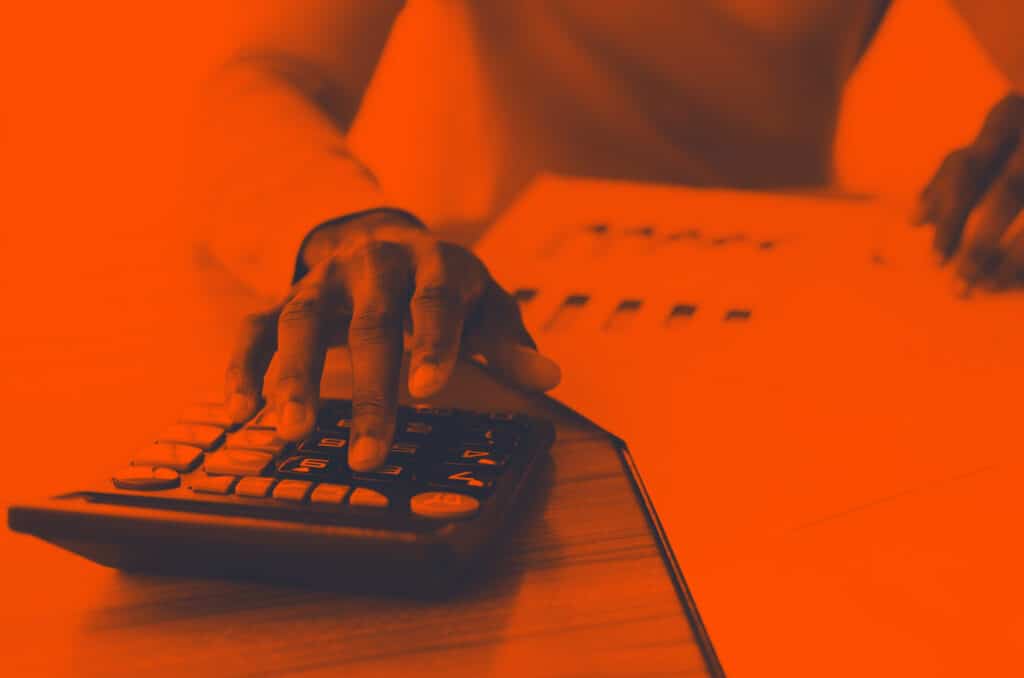 someone doing sums on a calculator