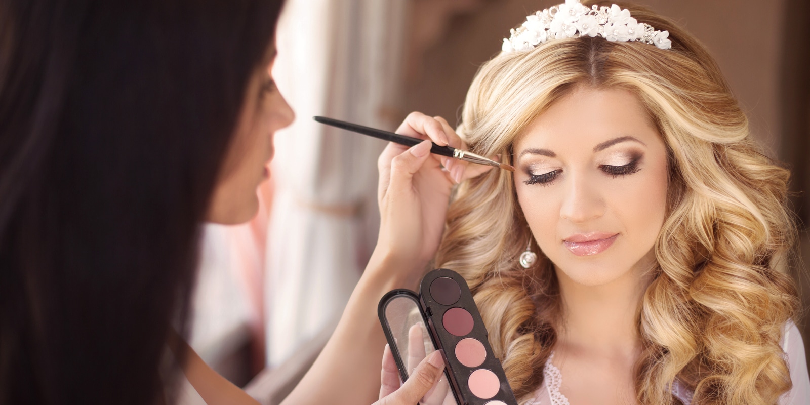 An image of a bride getting her make up done