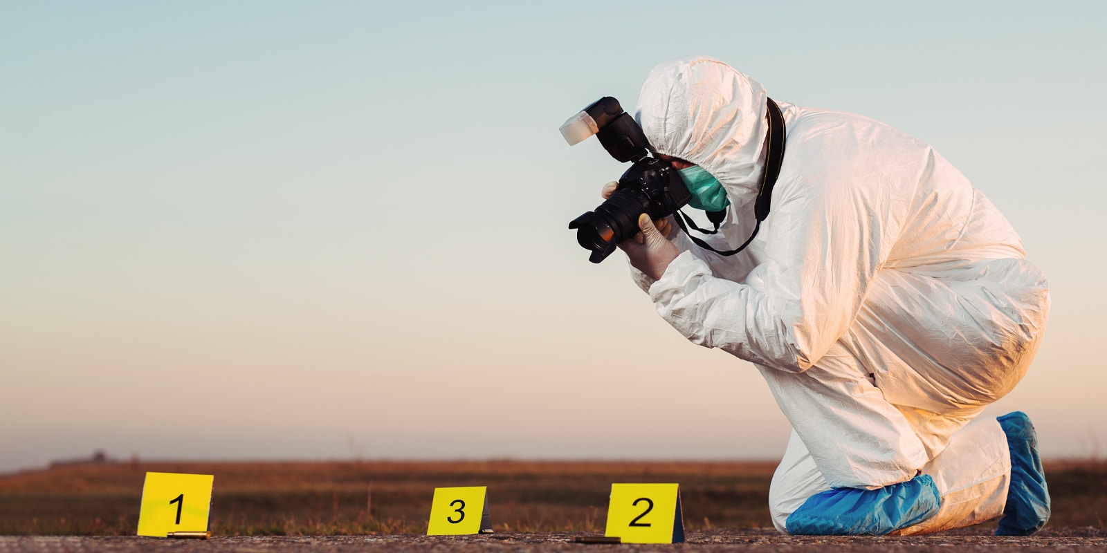 An image of a forensic scientist taking pictures