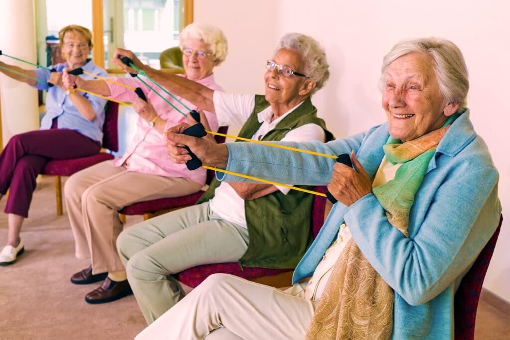 Elderly women using exercise bands