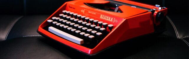 a bright orange vintage riviera typewriter